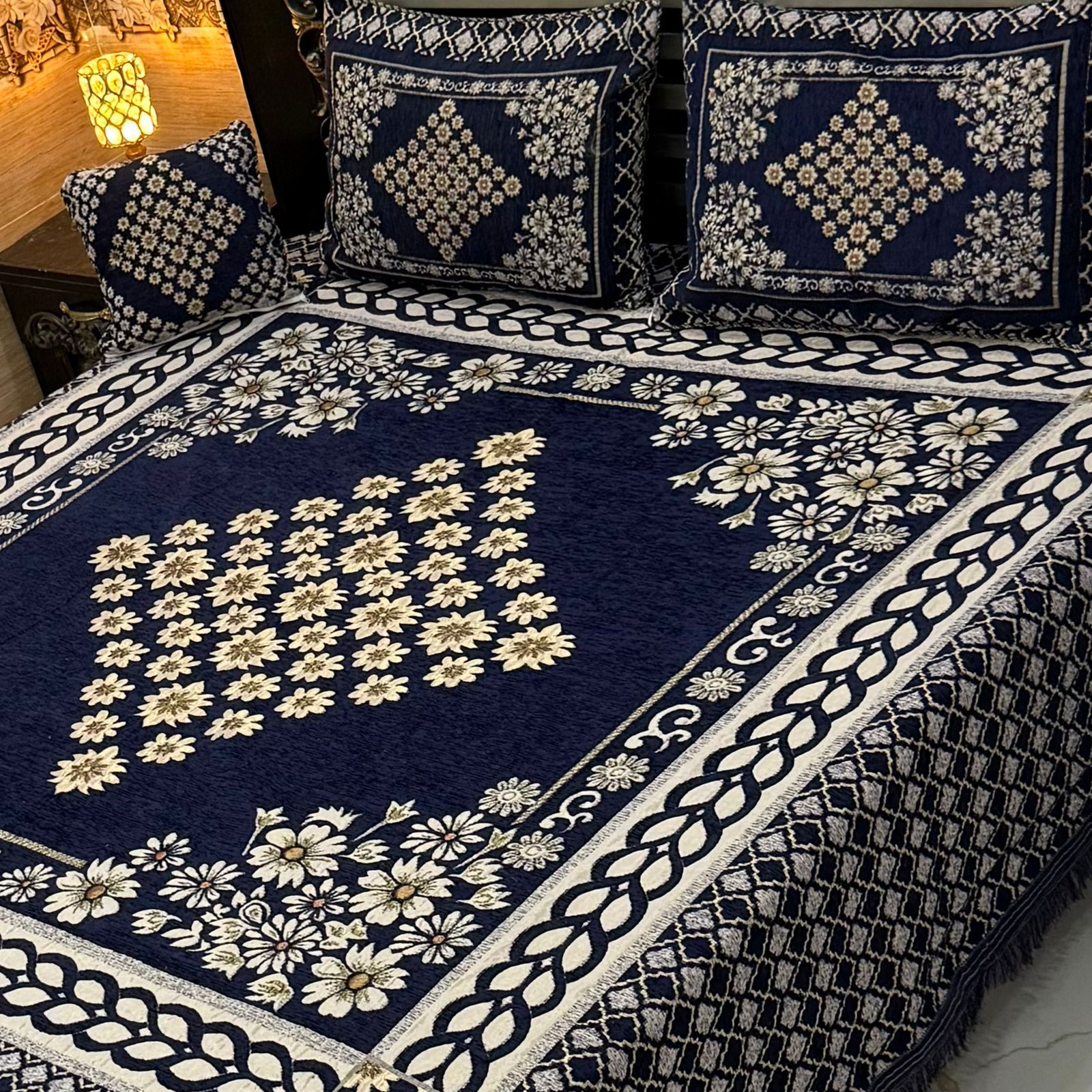 4Pc Velvet Jacquard King Size Bedsheet Set with navy blue floral design, includes 1 bedsheet, 2 pillow covers, and 1 cushion cover. Available in 70+ designs and colors. 100% color guaranteed.