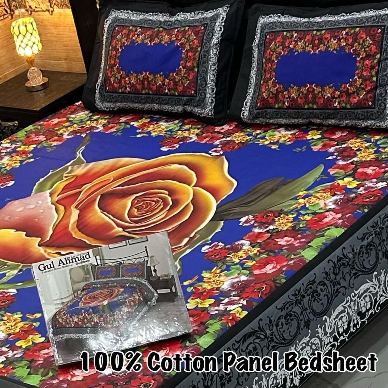 King Size Cotton Bedsheet with orange-red rose floral panel design on blue background, includes matching pillow covers. Available in 50+ designs and colors.
