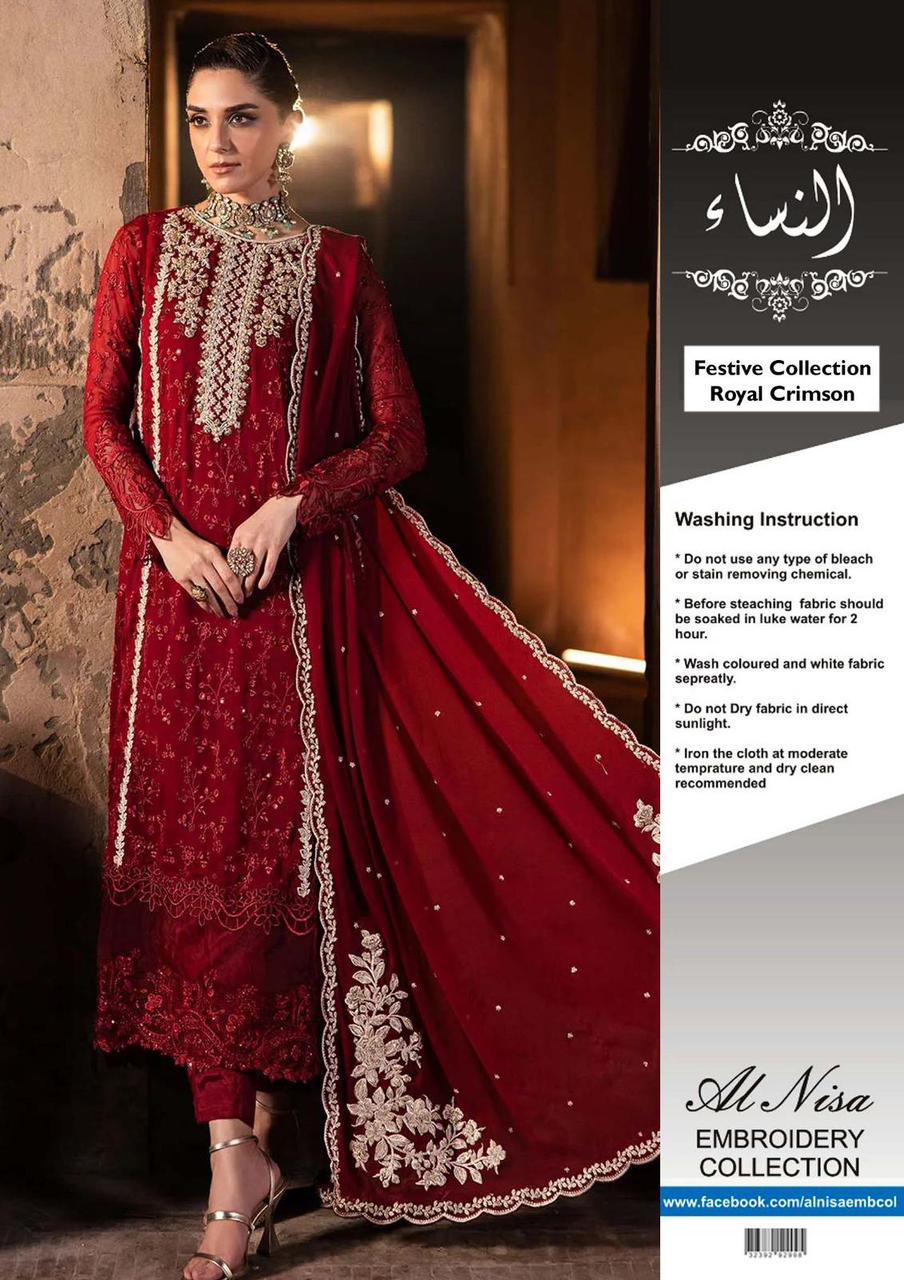 Woman wearing a Royal Crimson chiffon embroidered suit with adda neckline, embroidered daman patches, and chiffon dupatta, styled in a festive setting with elegant jewelry.